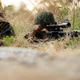 Sniper team hidden in tall grass during military reconnaissance exercise Sniper team hidden in tall grass during military reconnaissance exercise - PhotoDune Item for Sale