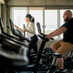 Female fitness trainer coaching an overweight beginner on elliptical machines during a cardio workou Female fitness trainer coaching an overweight beginner on elliptical machines during a cardio workou - PhotoDune Item for Sale
