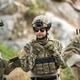Military personnel discuss equipment and mission details during a tactical field briefing Military personnel discuss equipment and mission details during a tactical field briefing - PhotoDune Item for Sale