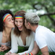 LGBTQ friends relaxing together by the lakeside sharing joyful moments LGBTQ friends relaxing together by the lakeside sharing joyful moments - PhotoDune Item for Sale
