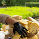 Cheese market with gloved hand reaching for stacked assortment of various cheese blocks Cheese market with gloved hand reaching for stacked assortment of various cheese blocks - PhotoDune Item for Sale