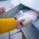 Girl Picking Up A Parcel From Parcel Automated Locker Girl Picking Up A Parcel From Parcel Automated Locker - PhotoDune Item for Sale