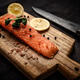 Red Fish Salmon Fillet With Herbs and Lemon on a Cutting Board Red Fish Salmon Fillet With Herbs and Lemon on a Cutting Board - PhotoDune Item for Sale