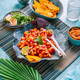 Traditional Mexican tomato salad with lime, onions and nachos with assorted dips Traditional Mexican tomato salad with lime, onions and nachos with assorted dips - PhotoDune Item for Sale