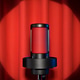 Black microphone glowing red light with spotlight on red stage curtain. Black microphone glowing red light with spotlight on red stage curtain. - PhotoDune Item for Sale