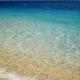 Crystal clear turquoise sea lapping sandy beach. Crystal clear turquoise sea lapping sandy beach. - PhotoDune Item for Sale