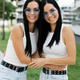 Customer Twin Sisters Smiling and Hugging Outdoors Customer Twin Sisters Smiling and Hugging Outdoors - PhotoDune Item for Sale