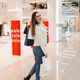 Stylish Woman Walks Away Looking Back in Mall During Sale Event Stylish Woman Walks Away Looking Back in Mall During Sale Event - PhotoDune Item for Sale
