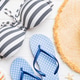Woman swimwear and beach accessories flat lay top view on colored background Summer travel concept. Woman swimwear and beach accessories flat lay top view on colored background Summer travel concept. - PhotoDune Item for Sale