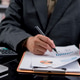 Close up businessman hand analyzing financial report data with calculator. Professional accountant w Close up businessman hand analyzing financial report data with calculator. Professional accountant w - PhotoDune Item for Sale