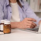 Close up senior hand using laptop with medicine bottles. Elderly patient ordering prescription drug Close up senior hand using laptop with medicine bottles. Elderly patient ordering prescription drug - PhotoDune Item for Sale
