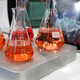 Laboratory with glassware tube reactors and colorful liquids in testing processes. Laboratory with glassware tube reactors and colorful liquids in testing processes. - PhotoDune Item for Sale