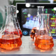 Laboratory with glassware tube reactors and colorful liquids in testing processes. Laboratory with glassware tube reactors and colorful liquids in testing processes. - PhotoDune Item for Sale
