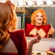 Smiling Drag Queen Getting Ready at Dressing Table in a Theater Backstage Smiling Drag Queen Getting Ready at Dressing Table in a Theater Backstage - PhotoDune Item for Sale