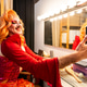 Smiling Drag Queen Prepares in Dressing Room With Mirror and Lights Before Performance Smiling Drag Queen Prepares in Dressing Room With Mirror and Lights Before Performance - PhotoDune Item for Sale