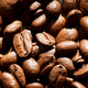Close-up of roasted coffee beans with rich texture and natural sunlight. Macro background of brown a Close-up of roasted coffee beans with rich texture and natural sunlight. Macro background of brown a - PhotoDune Item for Sale