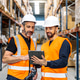 Warehouse workers collaborating on tablet in logistics center Warehouse workers collaborating on tablet in logistics center - PhotoDune Item for Sale
