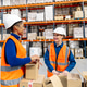 Female workers packing boxes in logistics warehouse Female workers packing boxes in logistics warehouse - PhotoDune Item for Sale