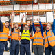 Diverse logistics workers celebrating teamwork in warehouse Diverse logistics workers celebrating teamwork in warehouse - PhotoDune Item for Sale
