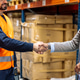 Workers shaking hands doing business agreement in warehouse Workers shaking hands doing business agreement in warehouse - PhotoDune Item for Sale