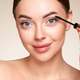 Beauty woman applying black mascara on eyelashes Beauty woman applying black mascara on eyelashes - PhotoDune Item for Sale
