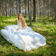 Girl wakes up in a summer forest Girl wakes up in a summer forest - PhotoDune Item for Sale