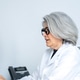 Senior female doctor providing medical consultation in office Senior female doctor providing medical consultation in office - PhotoDune Item for Sale