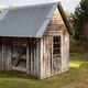 Rustic Wooden Shed Amidst Lush Greenery Rustic Wooden Shed Amidst Lush Greenery - PhotoDune Item for Sale