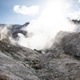 Steam Rising Over Volcanic Landscape Under Sunlight Steam Rising Over Volcanic Landscape Under Sunlight - PhotoDune Item for Sale