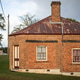 Historic Brick House Surrounded By Natural Scenery Historic Brick House Surrounded By Natural Scenery - PhotoDune Item for Sale