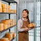 Female warehouse employee managing inventory, inspecting parcel boxes, organizing stock, and handlin Female warehouse employee managing inventory, inspecting parcel boxes, organizing stock, and handlin - PhotoDune Item for Sale