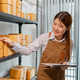 Female warehouse employee managing inventory, inspecting parcel boxes, organizing stock, and handlin Female warehouse employee managing inventory, inspecting parcel boxes, organizing stock, and handlin - PhotoDune Item for Sale