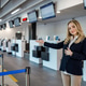 Check-in at the airport with a staff member guiding travelers in a modern setting Check-in at the airport with a staff member guiding travelers in a modern setting - PhotoDune Item for Sale