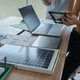 Two colleagues review a digital tablet beside laptops and renewable energy models in a bright modern Two colleagues review a digital tablet beside laptops and renewable energy models in a bright modern - PhotoDune Item for Sale