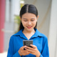 Asian businesswoman standing typing on smartphone at outside building Asian businesswoman standing typing on smartphone at outside building - PhotoDune Item for Sale