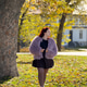 Woman smiling under autumn trees with sunlight. Joy, openness, and self-expression in harmony with n Woman smiling under autumn trees with sunlight. Joy, openness, and self-expression in harmony with n - PhotoDune Item for Sale