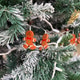 Gingerbread ornaments hanging on frosted Christmas tree branches. Playful holiday decor, winter deta Gingerbread ornaments hanging on frosted Christmas tree branches. Playful holiday decor, winter deta - PhotoDune Item for Sale