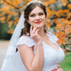 Bright Bride Against the Backdrop of Autumn Trees in Bright Bride Against the Backdrop of Autumn Trees in - PhotoDune Item for Sale