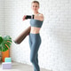 Young woman holding yoga mat on white studio background checking time on smartwatch Young woman holding yoga mat on white studio background checking time on smartwatch - PhotoDune Item for Sale