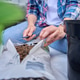 Woman opening bag of clay pebbles for plants Woman opening bag of clay pebbles for plants - PhotoDune Item for Sale