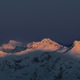 Snowy mountain peaks at sunset with dramatic sky Snowy mountain peaks at sunset with dramatic sky - PhotoDune Item for Sale