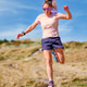 Female Trail Runner Jumping on Rocky Path Female Trail Runner Jumping on Rocky Path - PhotoDune Item for Sale
