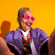 Senior woman smiling taking a colorful selfie Senior woman smiling taking a colorful selfie - PhotoDune Item for Sale