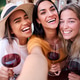 Three happy female friends taking selfie and drinking red wine in italian restaurant Three happy female friends taking selfie and drinking red wine in italian restaurant - PhotoDune Item for Sale