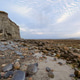 Golden sunset illuminating Silverstrand rocky shoreline in Galway Ireland with dramatic clouds, tida Golden sunset illuminating Silverstrand rocky shoreline in Galway Ireland with dramatic clouds, tida - PhotoDune Item for Sale