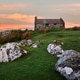 Rust stained tin roof cottage on windswept Connemara hillside overlooking rugged Galway landscape un Rust stained tin roof cottage on windswept Connemara hillside overlooking rugged Galway landscape un - PhotoDune Item for Sale