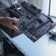Computer engineer repairing computer motherboard and hardware components. Computer engineer repairing computer motherboard and hardware components. - PhotoDune Item for Sale