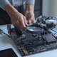 Close up of electronic technician hands working on computer hardware and mainboard repair. Close up of electronic technician hands working on computer hardware and mainboard repair. - PhotoDune Item for Sale