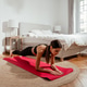 Young fit woman doing plank exercise on yoga mat at home in bedroom during morning routine Young fit woman doing plank exercise on yoga mat at home in bedroom during morning routine - PhotoDune Item for Sale
