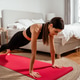 Young fit woman doing plank exercise on yoga mat at home in bedroom during morning routine Young fit woman doing plank exercise on yoga mat at home in bedroom during morning routine - PhotoDune Item for Sale